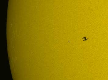 Space Station and Shuttle cross sun