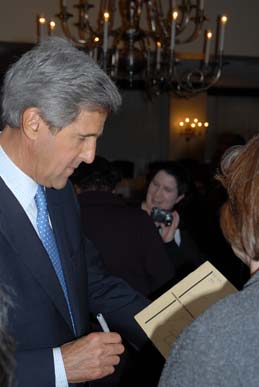 Kerry signs an autograph